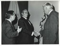 ["Black and white photograph print of Carl Albert, President Josip B. Tito of Yugoslavia, and others standing in Albert's office. November 1971"]
