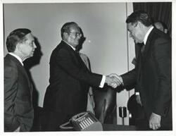 ["Black and white photograph print of President Josip B. Tito of Yugoslavia shaking hands with Hale Boggs. Carl Albert is also shown."]