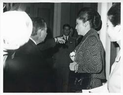 ["Black and white photograph print of Imelda Marcos of the Philippines speaking with Carl Albert during her visit to the U.S. on January 18, 1973"]