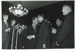 ["Black and white photograph print of Carl Albert in various poses with the Shenyang Acrobatic Troupe. January 13, 1973"]