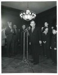 ["Black and white photograph print of Carl Albert in various poses with the Shenyang Acrobatic Troupe. January 13, 1973"]