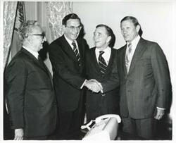 ["Black and white photograph print of President Leone of Italy, Edward Boland, Carl Albert, and John Volpe standing together. September 26, 1974"]