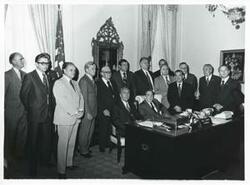 ["Black and white photograph print of Carl Albert as seated beside Polish First Secretary Edward Gierek during his visit to the U.S. Behind them is standing a large group including Dan Rostenkowski and Clement Zablocki. October 9, 1974"]
