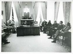["Black and white photograph print of John McFall, Carl Albert, Polish First Secretary Edward Gierek, Thomas P. O'Neill, and several others seated in Albert's office. October 9, 1974"]