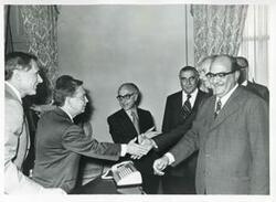 ["Black and white photograph print of Carl Albert with members of Egyptian Parliament. May 1, 1975"]