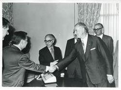 ["Black and white photograph print of Carl Albert shaking hands with members of Egyptian Parliament. May 1, 1975"]