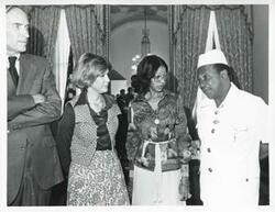 ["Black and white photograph print of Loise Butler talking with William R. Tolbert, Jr. (President of Liberia). September 23, 1976"]