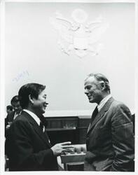 ["Black and white photograph print of Two unidentified men shaking hands during the Korean-U.S. Interparliamentary Conference. July 22-23, 1973"]
