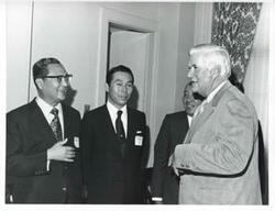 ["Black and white photograph print of Thomas P. O'Neill talking with several Korean men during the Korean-U.S. Interparliamentary Conference. July 22-23, 1973"]