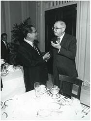 ["Black and white photograph print of two unidentified men talking during the Korean-U.S. Interparliamentary Conference. July 22-23, 1973"]
