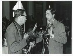["Black and white photograph print of unidentified men talking during the Korean-U.S. Interparliamentary Conference. July 22-23, 1973"]