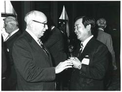 ["Black and white photograph print of unidentified men talking during the Korean-U.S. Interparliamentary Conference. July 22-23, 1973"]