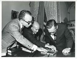 ["Black and white photograph print of Carl Albert in various poses with unidentified people."]