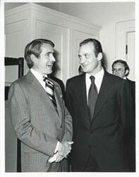 ["Black and white photograph print of King Juan Carlos of Spain talking with an unidentified man."]