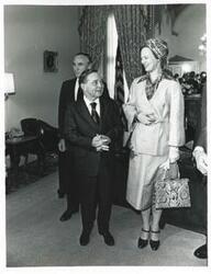 ["Black and white photograph print of Mike Mansfield, Carl Albert, and Queen Margrethe of Denmark talking with each other."]