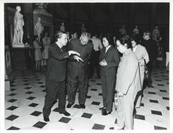 ["Black and white photograph print of Carl Albert talking to others during the luncheon for Huang Chen on October 9, 1975"]