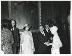 ["Black and white photograph print of Carl Albert speaking with Prince Phillip and Queen Elizabeth during their visit to the U.S."]