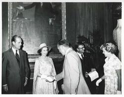 ["Black and white photograph print of Queen Elizabeth and Prince Phillip shaking hands with others during a visit to the U.S."]