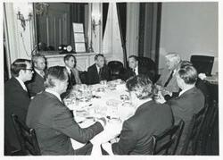 ["Black and white photograph print of Robert C. Byrd, John McFall, Carl Albert, Thomas P. O'Neill, Robert Strauss and Mike Mansfield with others seated at a table."]