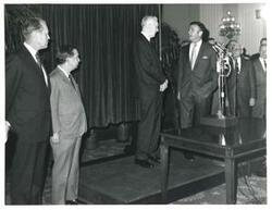 ["Black and white photograph print of Gerald R. Ford, Carl Albert, John W. McCormack, and others."]