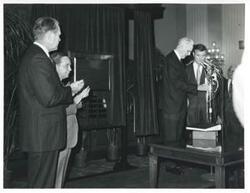 ["Black and white photograph print of Gerald R. Ford, Carl Albert, John W. McCormack, and others."]