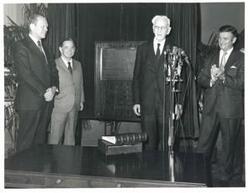["Black and white photograph print of Gerald R. Ford, Carl Albert, John W. McCormack, and others."]