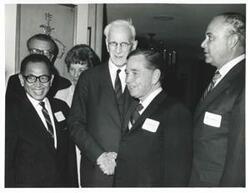 ["Black and white photograph print of Lawrence F. O'Brien and wife, John W. McCormack, Carl Albert, Robert Strauss at an unidentified function."]