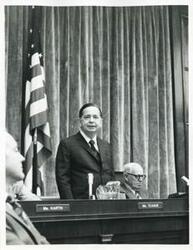 ["Black and white photograph print of Carl Albert speaking at an unidentified function."]