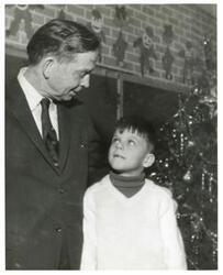 ["Black and white photograph print of Carl Albert standing with a young boy. March of Dimes, 1968"]