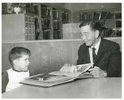 ["Black and white photograph print of Carl Albert speaking to a young boy. March of Dimes, 1968"]
