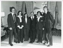 ["Black and white photograph print of Carl Albert posing with pages-Sam Fillingane, Barb Free, Karin Tills, Willa Perlmutter, and Hunter Harpole. November 1975"]