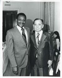 ["Black and white photograph print of Carl Albert posing with John McIntyre."]