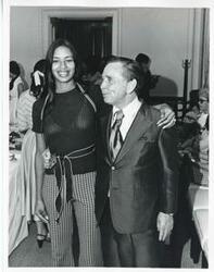 ["Black and white photograph print of Carl Albert posing with Sherry Tonubbee Stewart."]