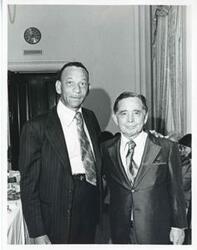 ["Black and white photograph print of Carl Albert posing with Irvin Nickens."]