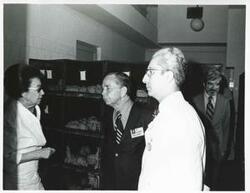 ["Black and white photograph print of Carl Albert with others during the House delegation trip. August 1975"]