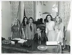 ["Black and white photograph print of Carl Albert with Ewing Interns. Left to right are Janice Hoffman, Melinda Wharton, Lewis Pulley, Albert, Sue Waldron, and Susan Rogers. July 25, 1975"]