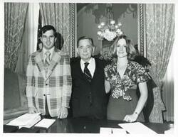 ["Black and white photograph print of Carl Albert posing with David Salmon and Nancy Jensen, May 1975"]