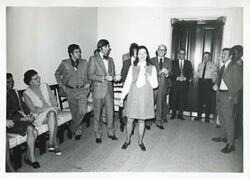 ["Black and white photograph print of Jane England Lawton and Charlie Ward with several others at Lawton's farewell party, March 8, 1974"]