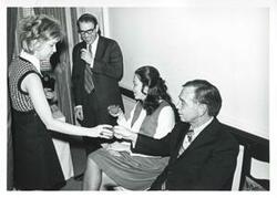 ["Black and white photograph print of Helen Newman Tuttle, Mike Reed, Jane England Lawton, and Carl Albert at Lawton's party. March 8, 1974"]