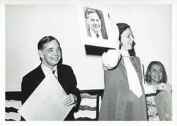 ["Black and white photograph print of Carl Albert and Jane England Lawton at her farewell party. March 8, 1974"]