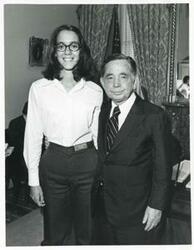 ["Black and white photograph print of Carl Albert posing with a unidentified people."]