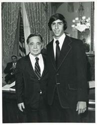 ["Black and white photograph print of Carl Albert posing with a unidentified people."]