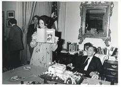 ["Black and white photograph print of Jane England Lawton with Carl Albert at Verneil's birthday."]