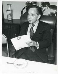 ["Black and white photograph print of Carl Albert sitting at his desk."]