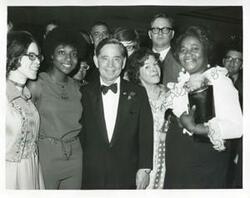 ["Black and white photograph print of Mary Frances Albert, Shirley Jeter, Carl Albert, Mary Albert, and other posing for a picture."]