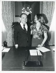 ["Black and white photograph print of Carl Albert posing with Nancy Jensen, a May 1975 intern."]