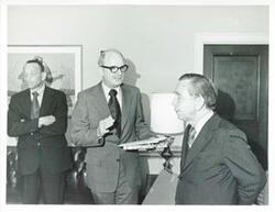 ["Black and white photograph print of Carl Albert talking to Charles L. Ward."]