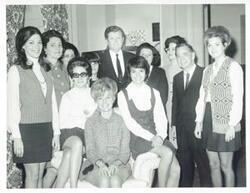 ["Black and white photograph print of Edward M. Kennedy, Carl Albert, Jane England Lawton, and several other people posing for a picture."]
