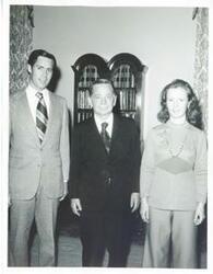 ["Black and white photograph print of Carl Albert with unidentified people."]