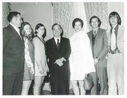 ["Black and white photograph print of Carl Albert in various poses with unidentified people."]